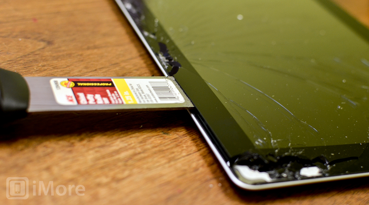Rock your iPad pry tool back and forth to help break the adhesive