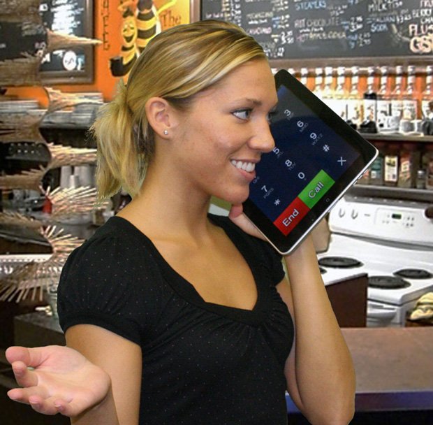 A girl using an iPad as a phone