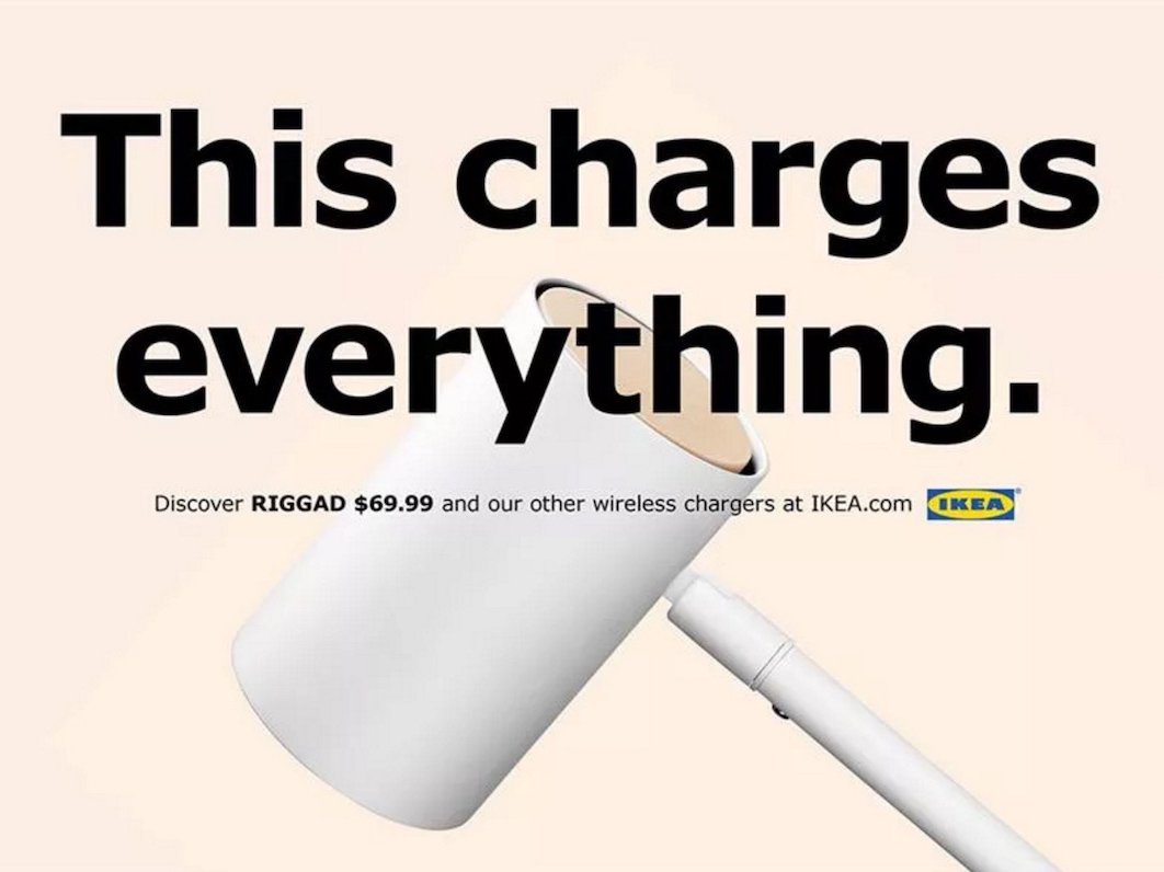 an IKEA ad showing a Qi wireless charging lamp with an apple perched atop the base and text that reads 'Link different.'