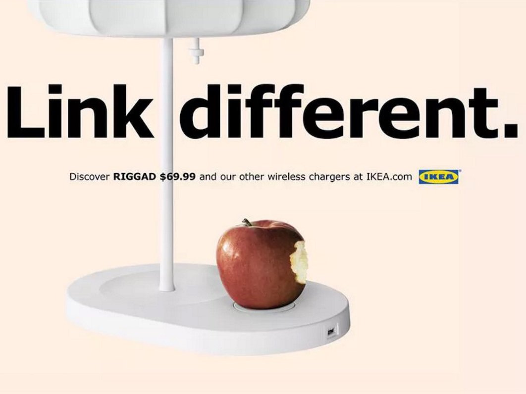 an IKEA ad showing a Qi wireless charging lamp with text that reads 'This charges everything.'