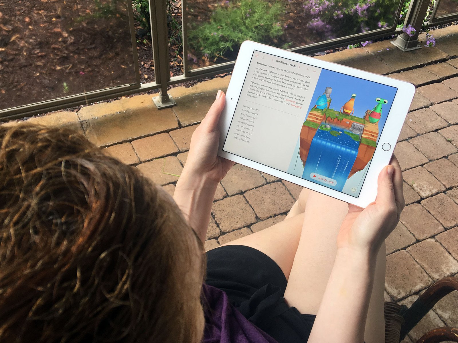 Person using Swift Playgrounds on iPad 