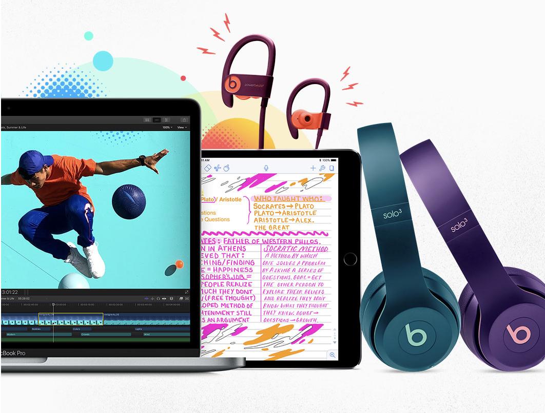 Various Apple products, including beats headphones and a macbook
