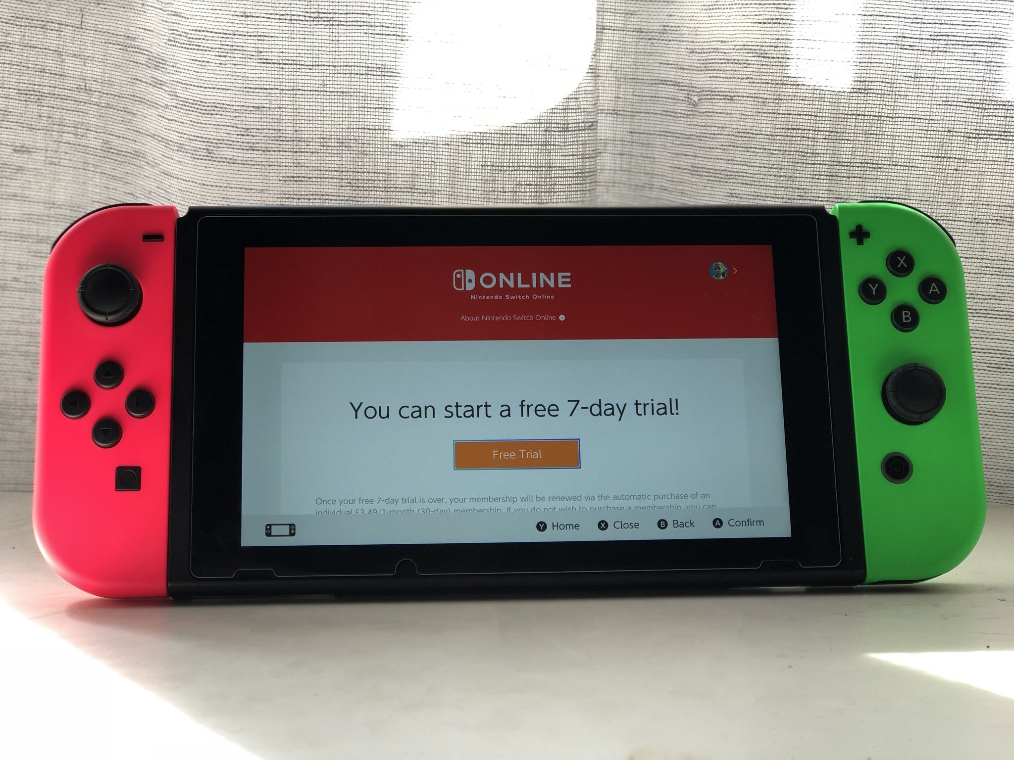 Nintendo Switch pink and green joy-con with Nintendo Switch Online trial