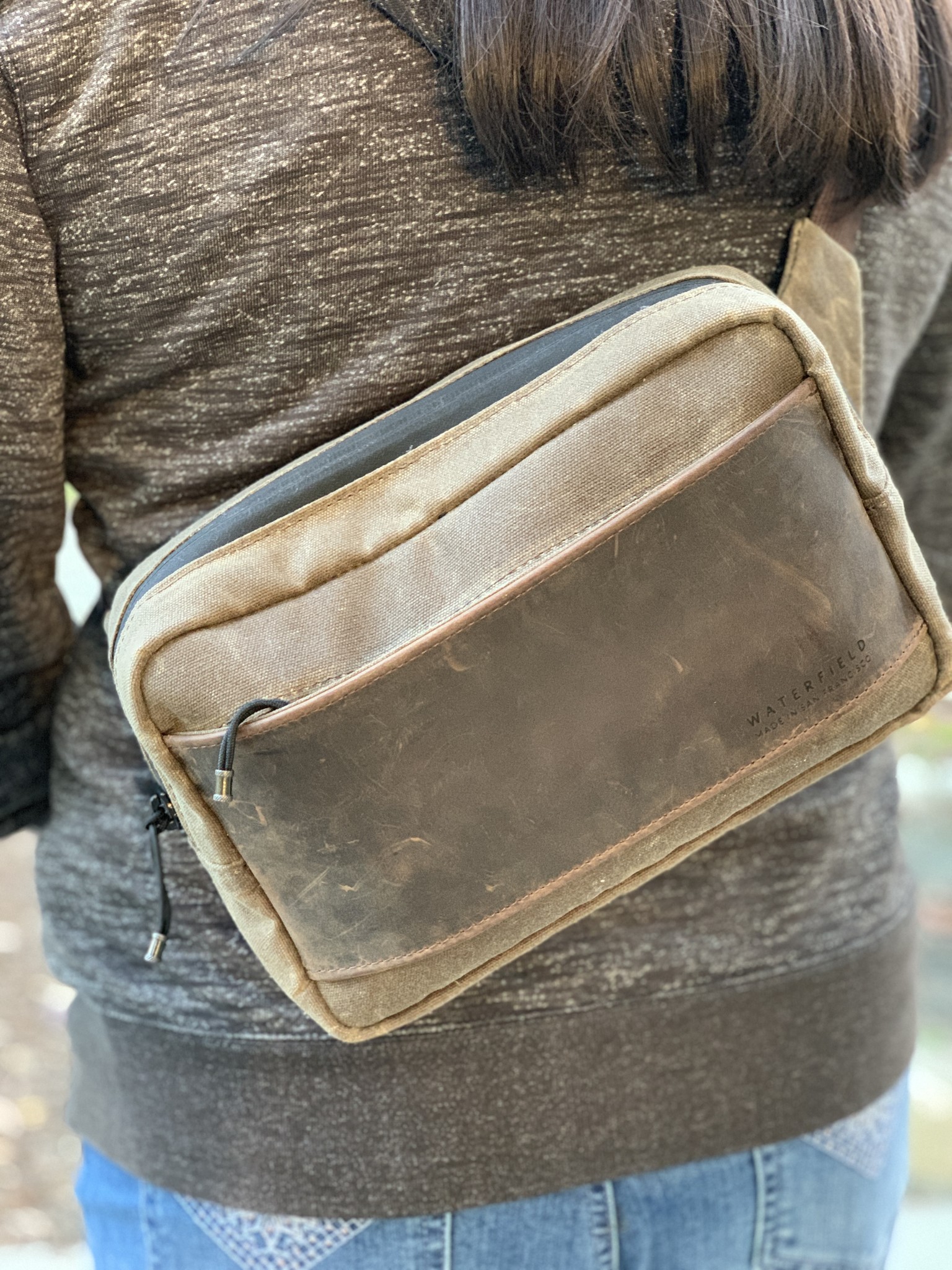 Waterfield Designs Sutter Sling Pouch for Nintendo Switch up close while worn by Christine Chan