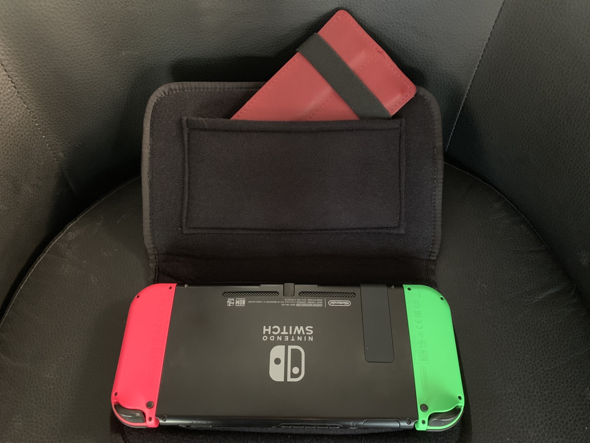 Waterfield Designs Switch Taco open with Nintendo Switch face down on front panel and 20-Game card sticking out of back pocket