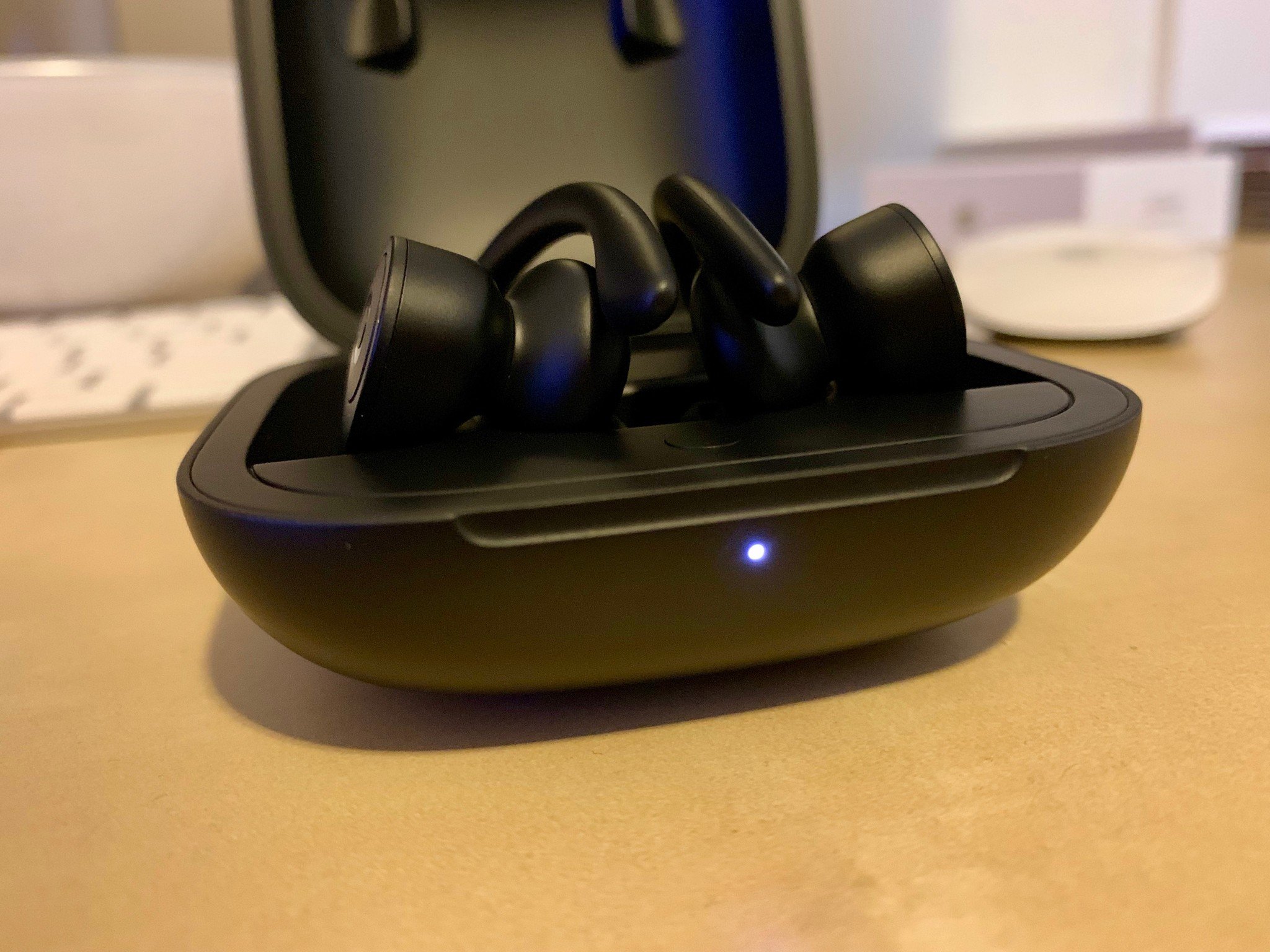 Powerbeats Pro with the glowing pairing light
