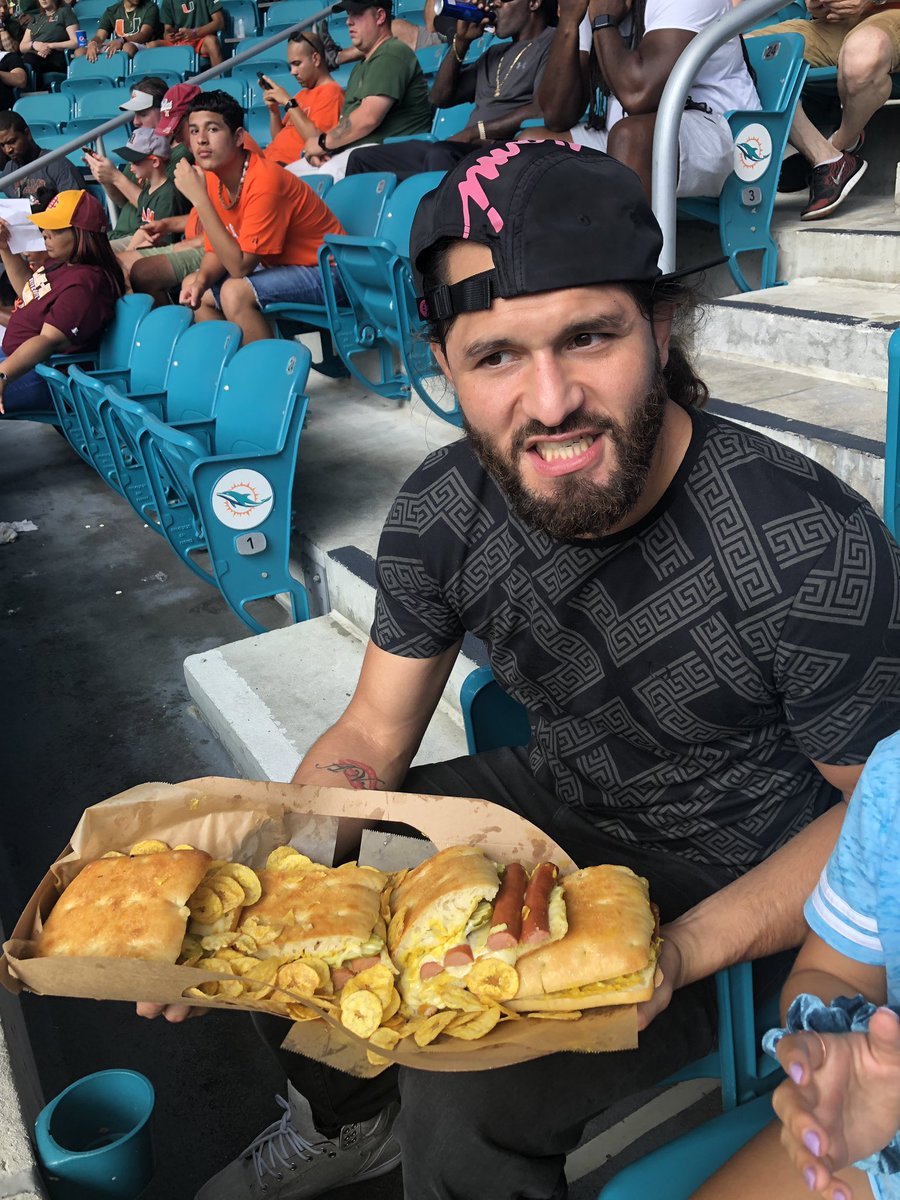 Jorge Masvidal eating huge meal at Miami Football game