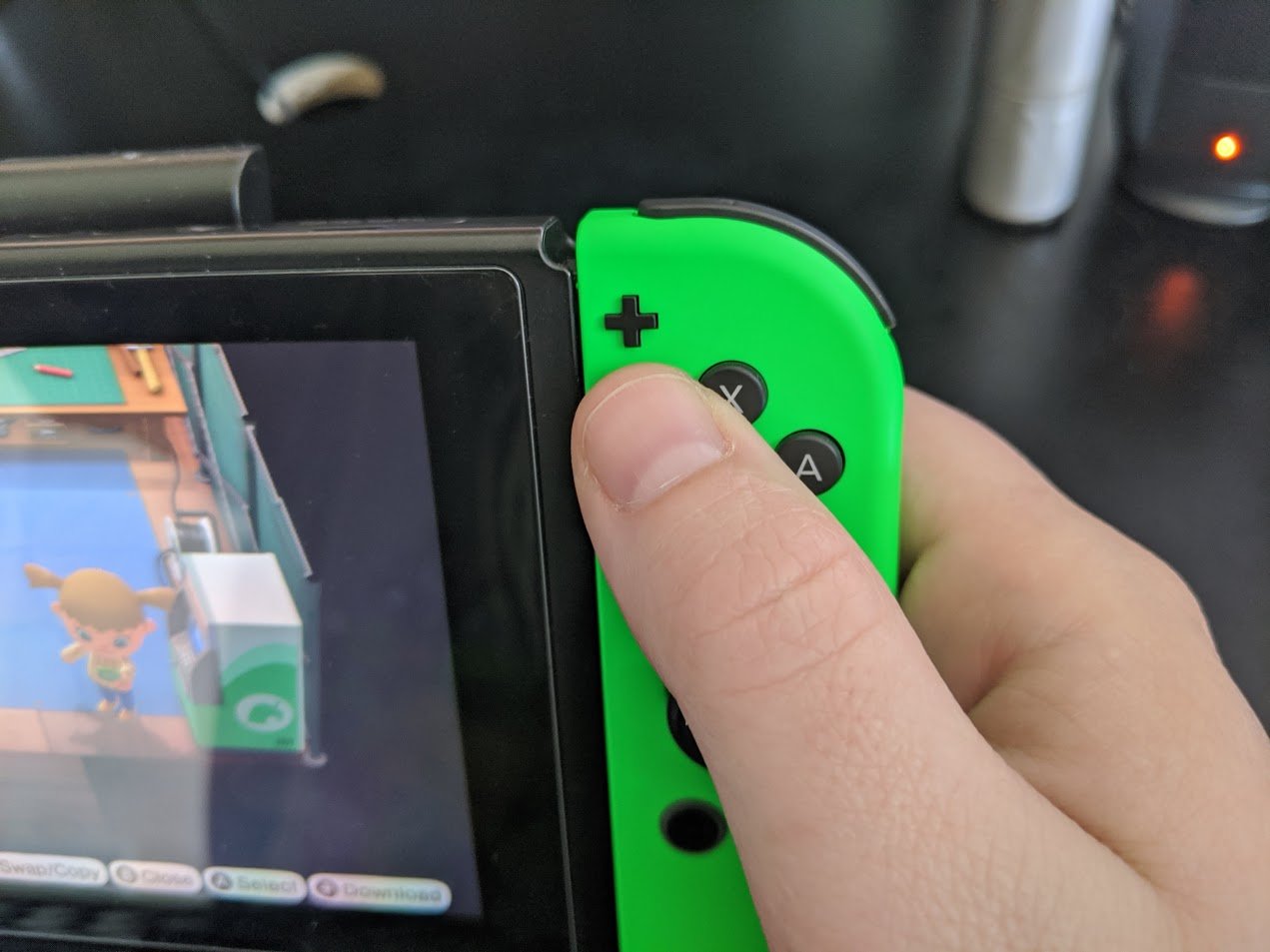 How to scan QR codes in ACNH: Press the + button on the right side of your Joy-Cons or controller