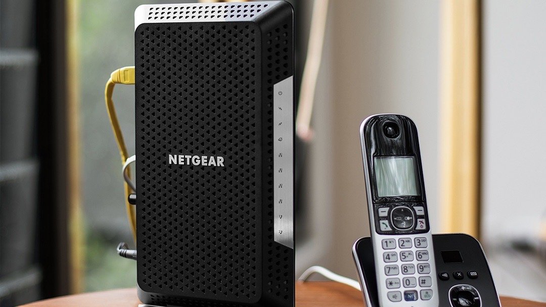 Netgear Nighthawk C7000 next to a phone