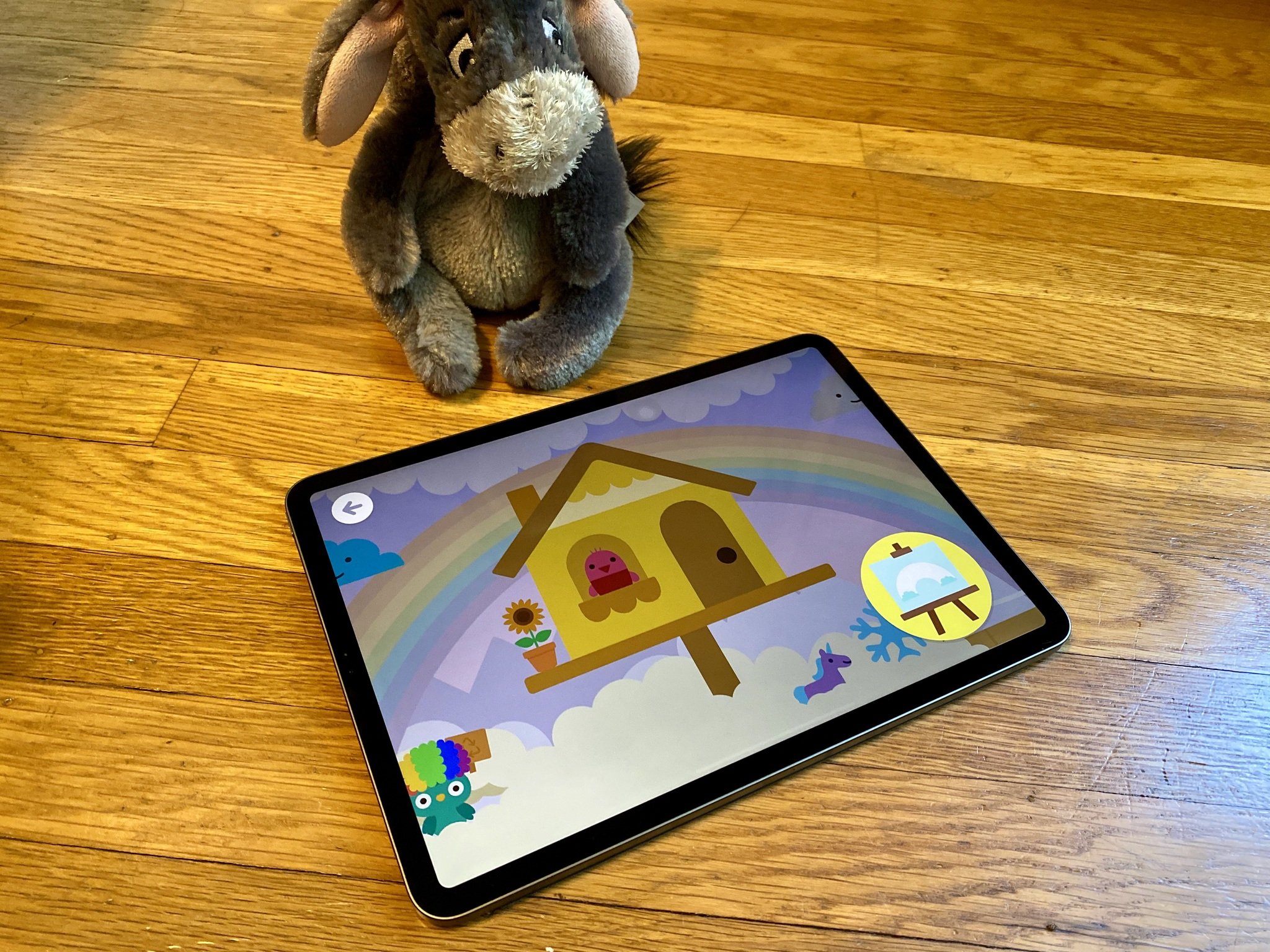 Sago Mini School on iPad Pro with Eeyore in the background