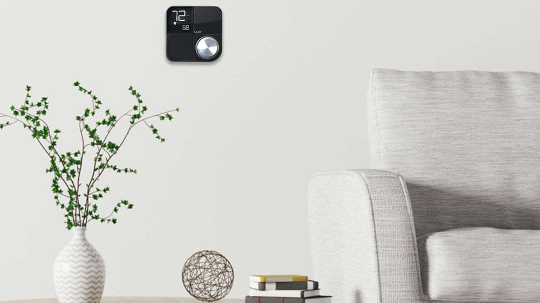 Lux Kono Smart Thermostat in a living room setting