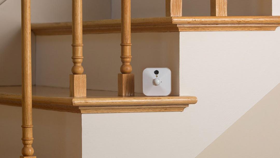 Blink Indoor Camera sitting on a staircase