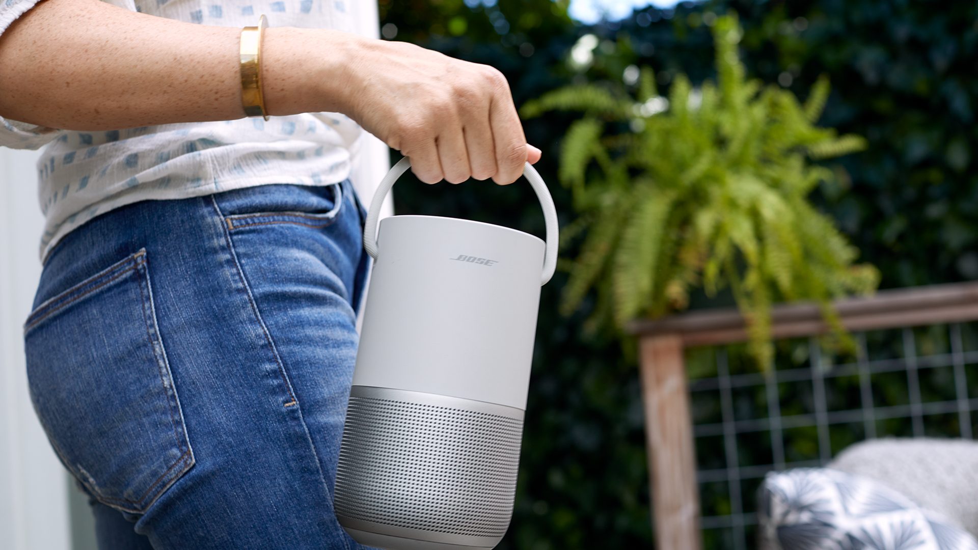 Bose Portable Smart Speaker carried outdoors