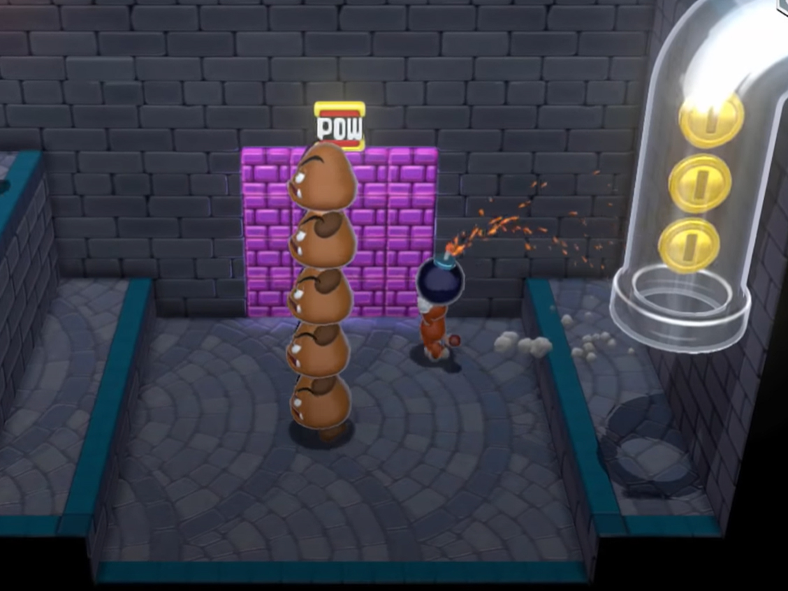 Super Mario 3D World Mario throwing a Bob-omb at a bunch of purple brick blocks