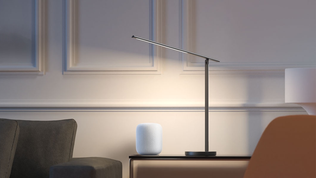 Meross Mdl110m Smart Led Desk Lamp on a table next to a HomePod