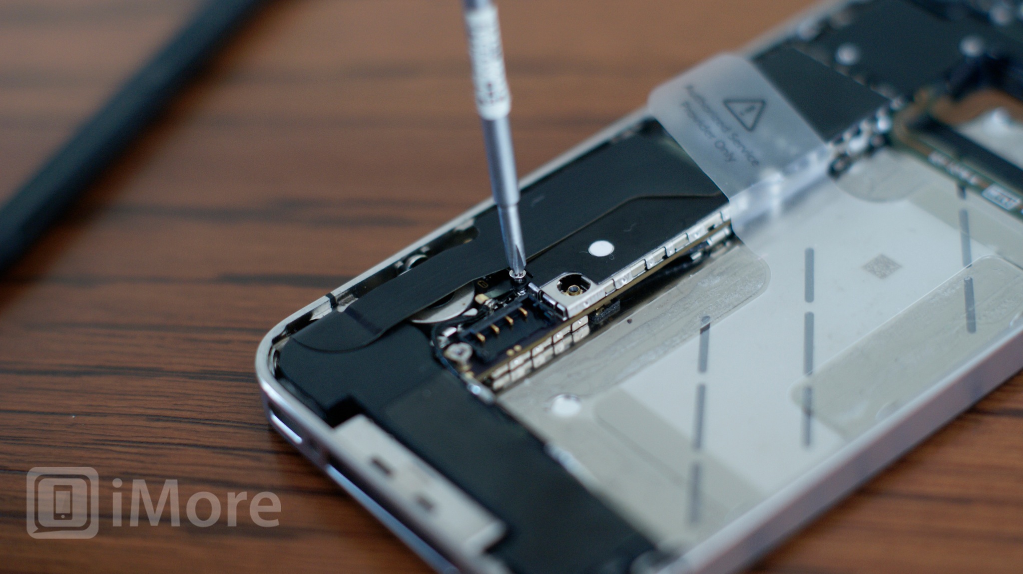 Remove grounding clip screw on CDMA iPhone 4