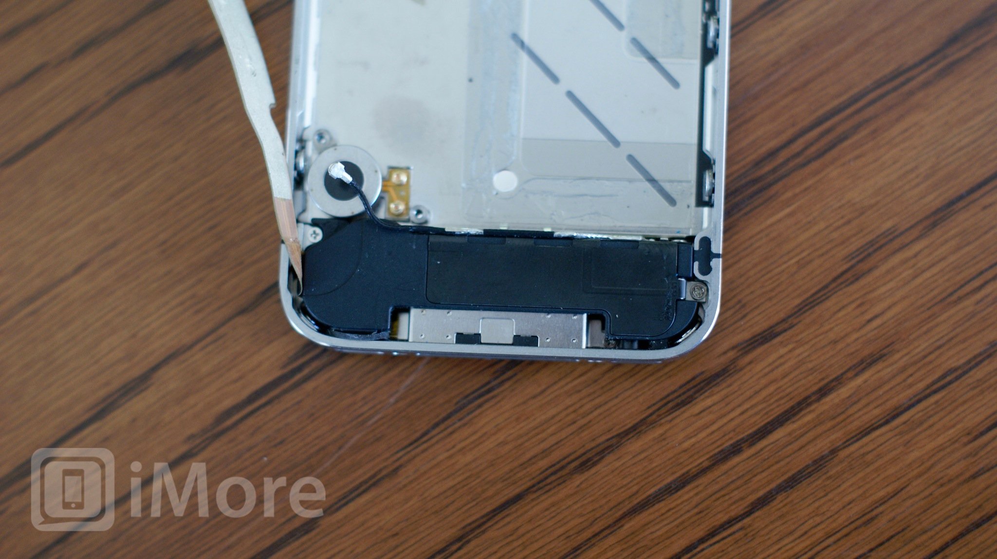 Remove the speaker assembly screws CDMA iPhone 4