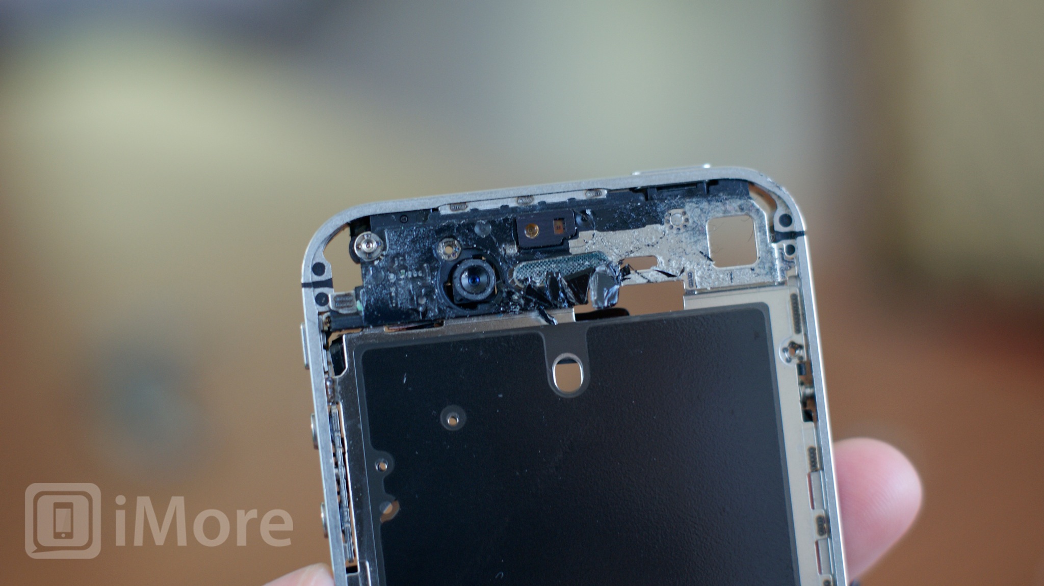 Remove glass and debris from top bottom and midframe CDMA iPhone 4