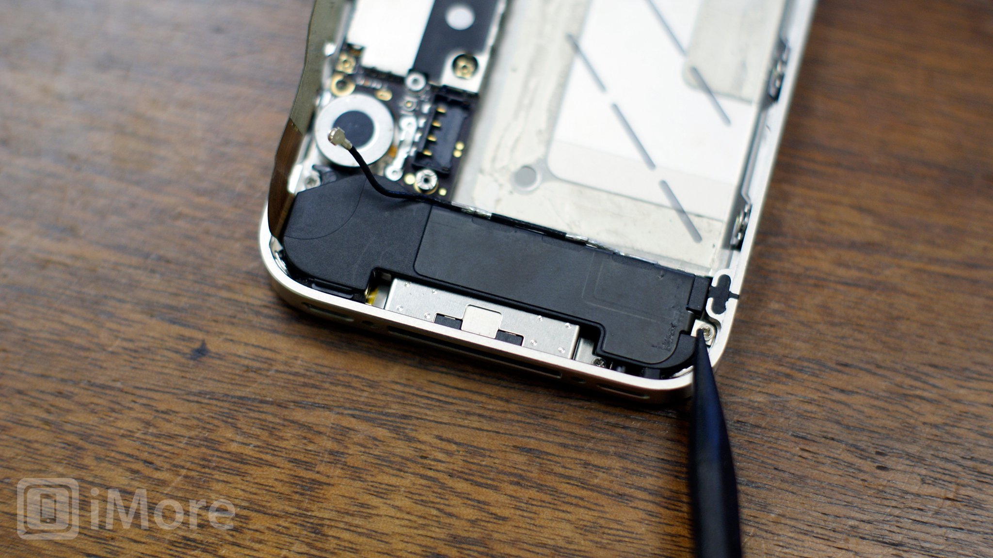 Remove the 2 screws holding down iPhone 4 speaker assembly