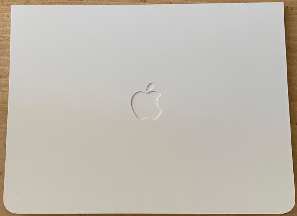 The front of the sleeve the Apple Card comes in is white with an Apple Logo debossed in the center