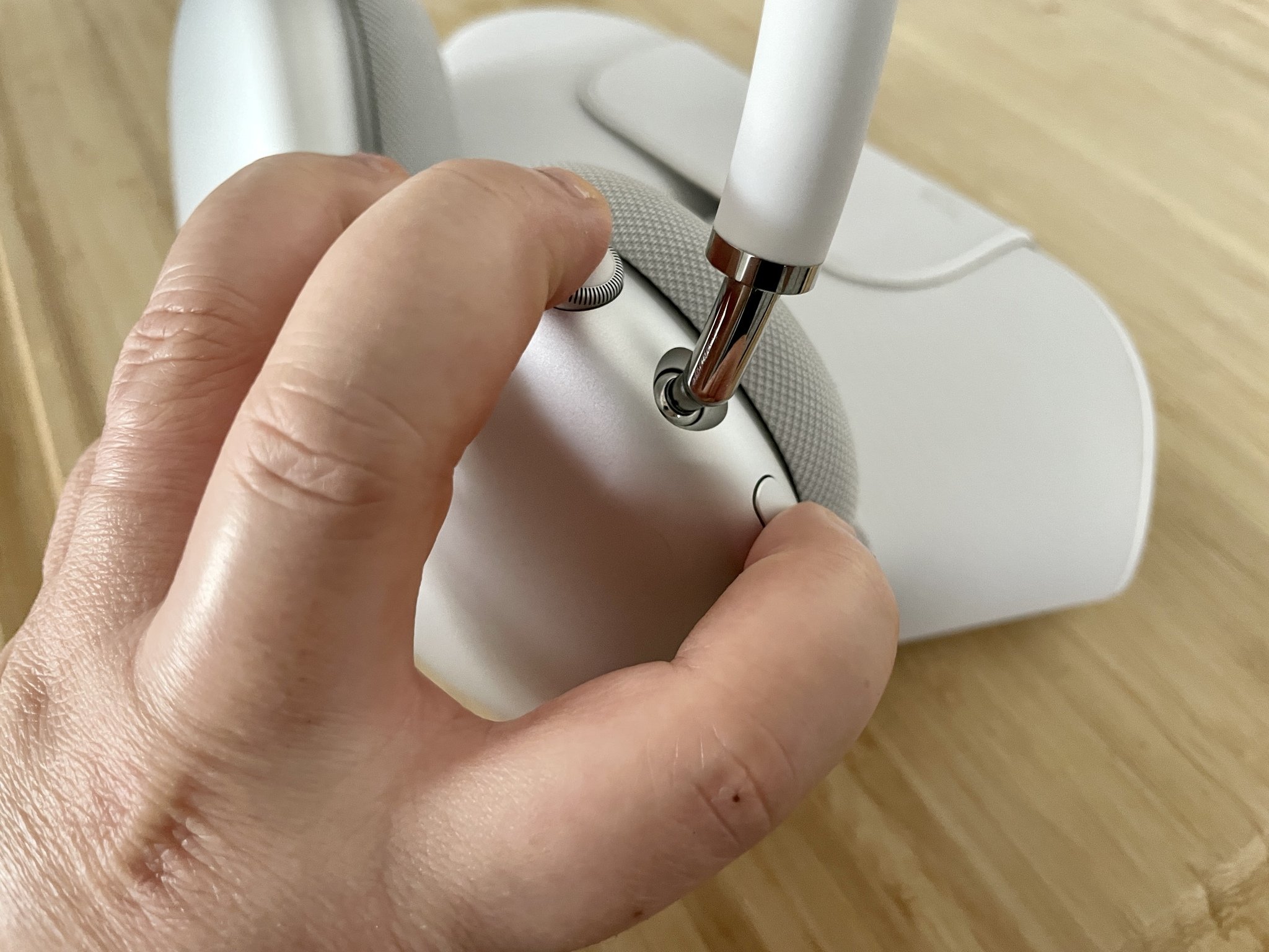 Restart AirPods Max by showing: Press the Digital Crown and Noise Control buttons at the same time for 12 seconds until the status light is flashing amber