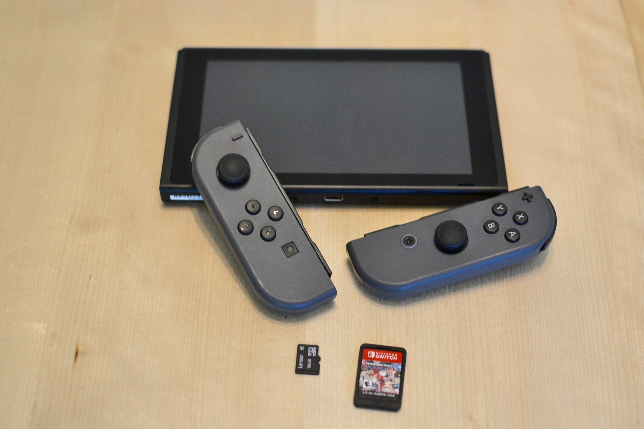 Power off your Switch, remove the card and cartridge, disconnect the Joy-Cons