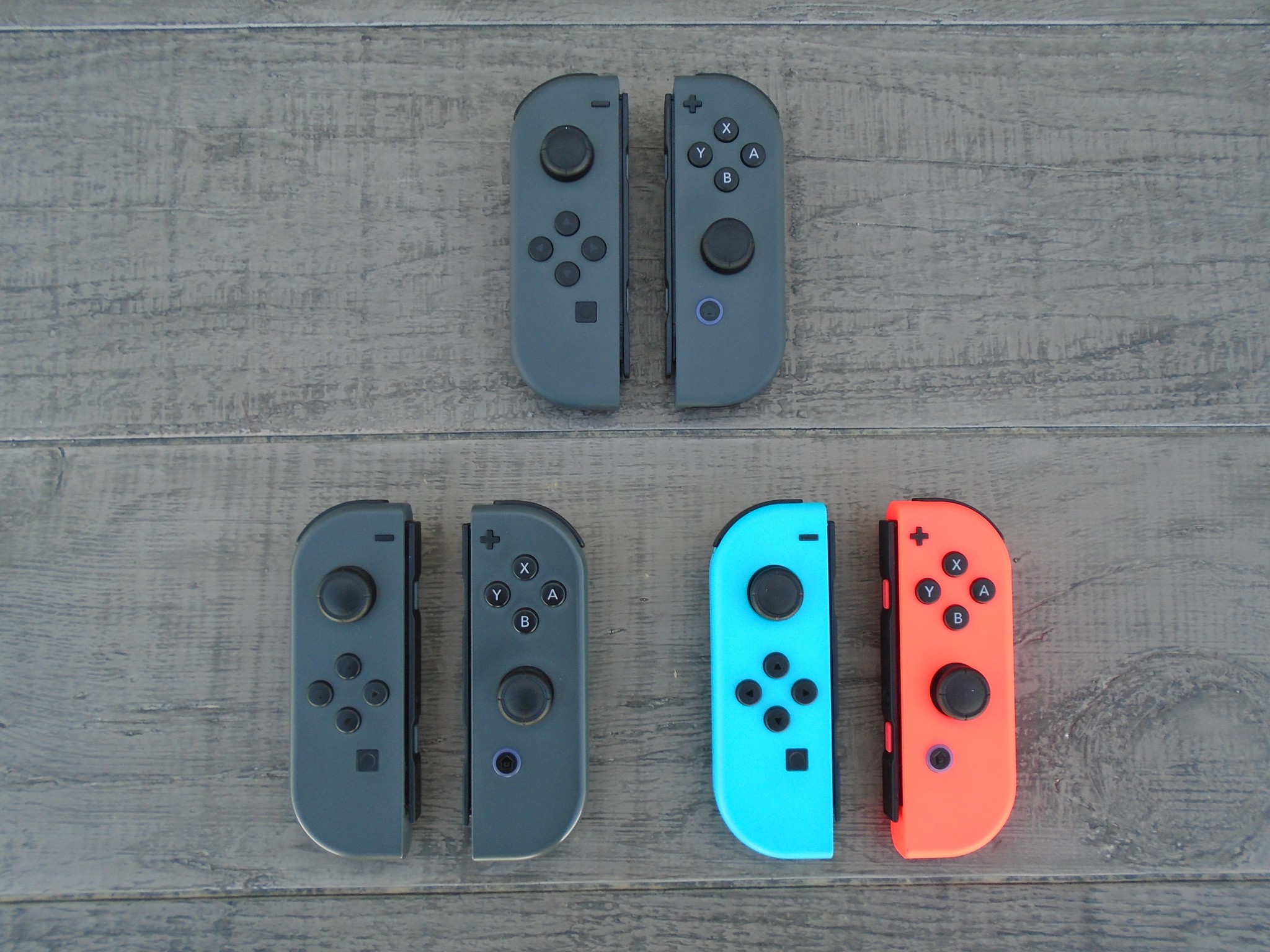 Two Gray Joy-Con pairs, and Neon Red Blue Joy-Cons