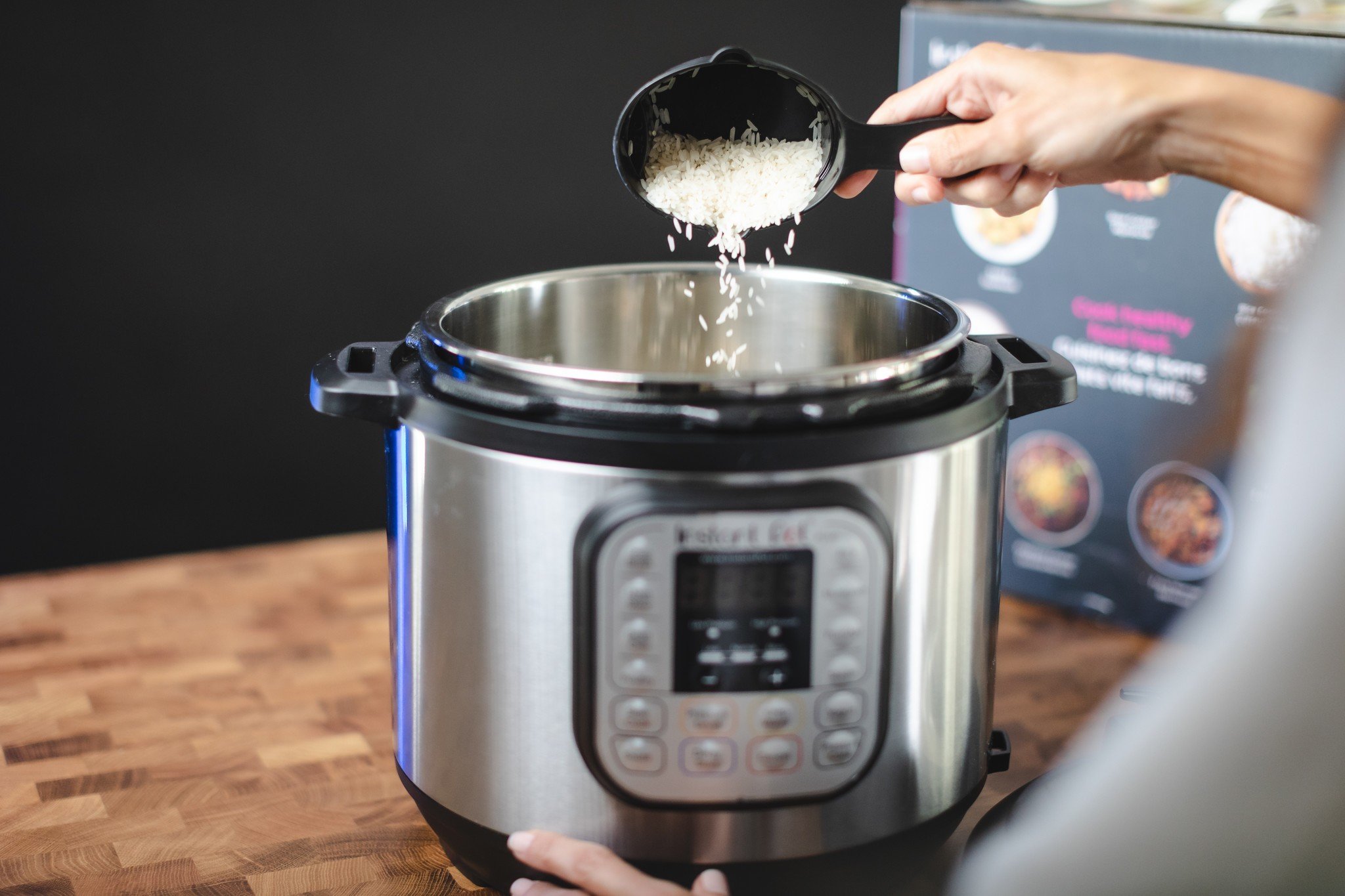Pouring rice into Instant Pot DUO60