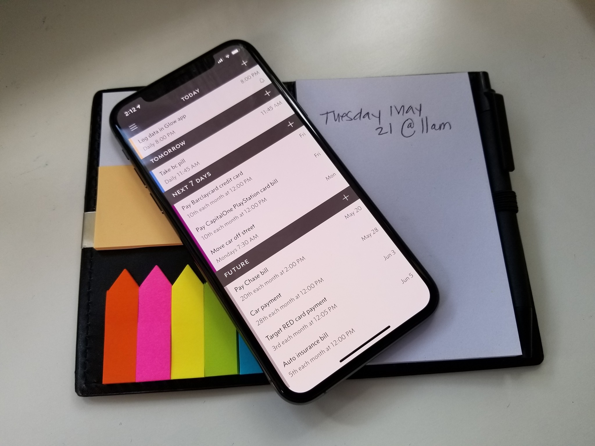 iPhone XS with Due 3 and paper notebook