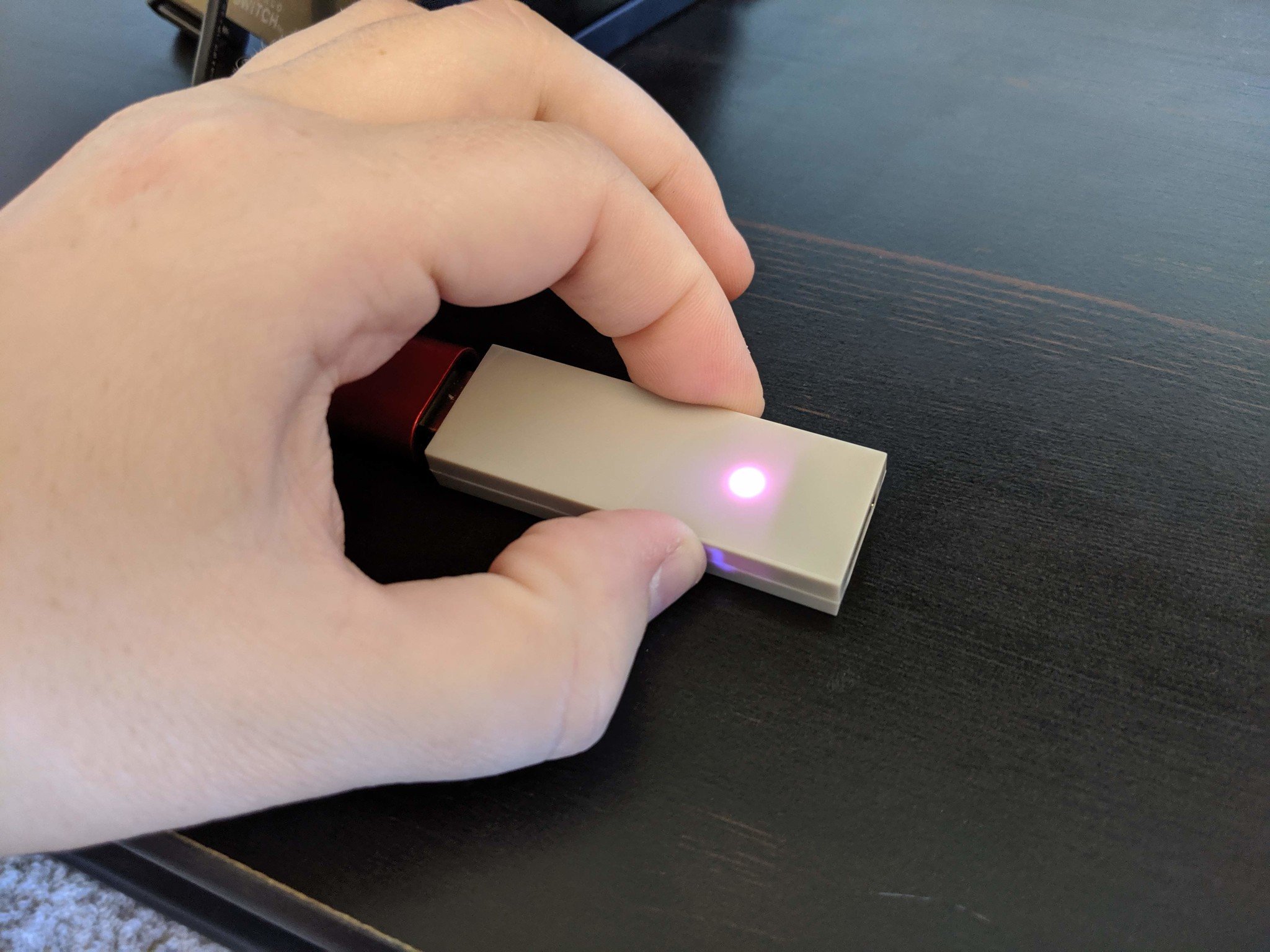 How to connect your Xbox One controller with the Nintendo Switch in wireless tabletop mode step three: hold the small black button on the side of the Magic-NS Adapter down for three to five seconds to turn the red or purple light on