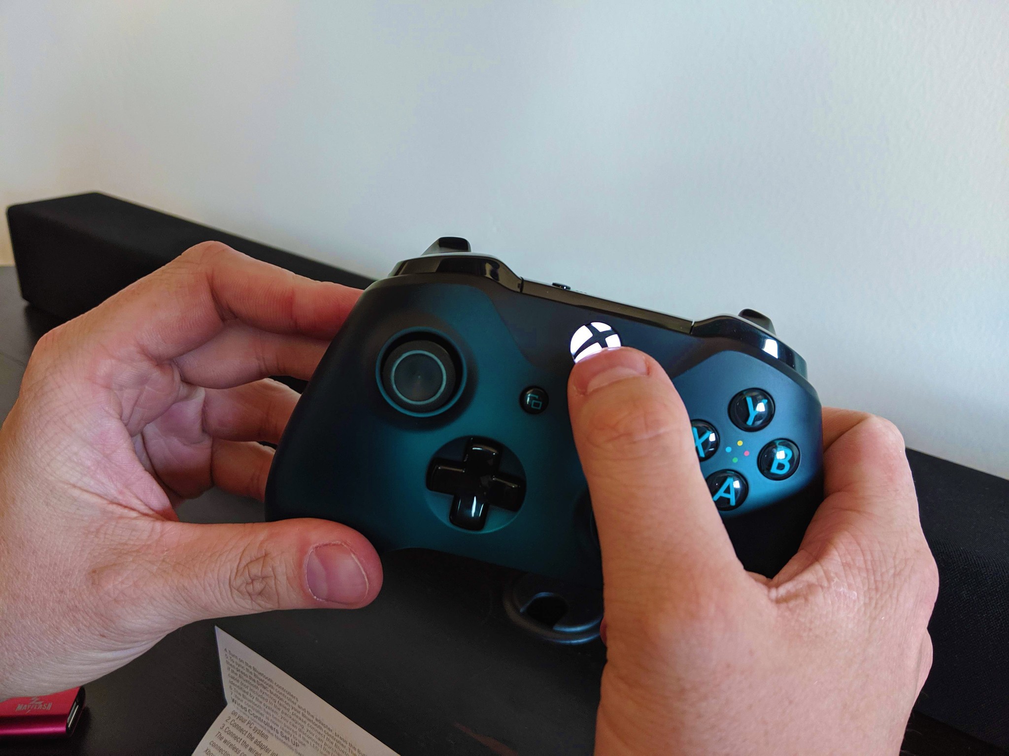 How to connect your Xbox One controller with the Nintendo Switch in wireless tabletop mode step five: With the LED flashing rapidly, grab your Xbox One controller and press the Xbox home button to wake it