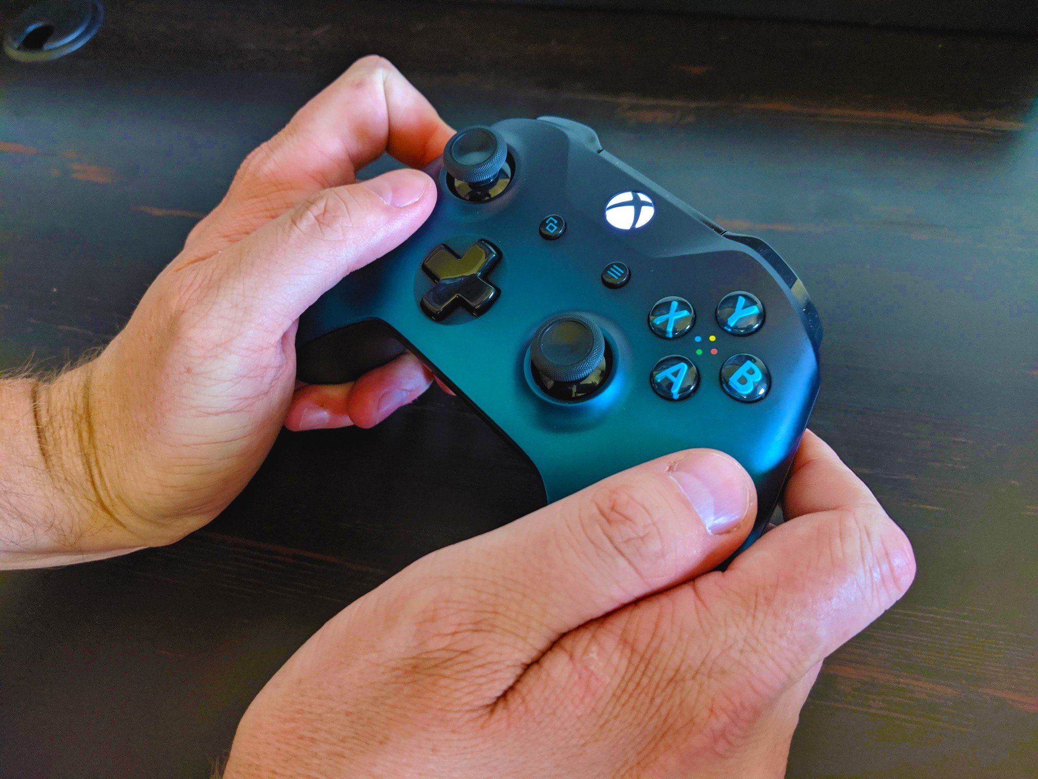 How to connect your Xbox One controller with the Nintendo Switch in wireless tabletop mode step seven: Hold the Xbox One controller near the Switch until the Xbox symbol stops flashing