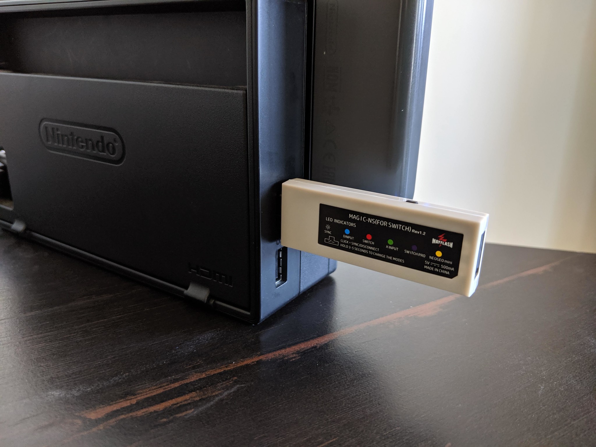 How to connect your Xbox One controller with the Nintendo Switch in wireless docked mode step one: Insert the Mayflash Magic-NS Adapter into one of the Nintendo Switch's USB ports