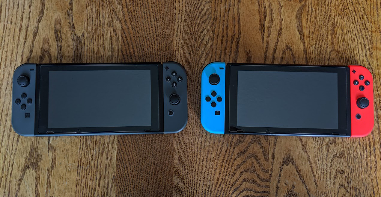 Two Nintendo Switch consoles next to each other