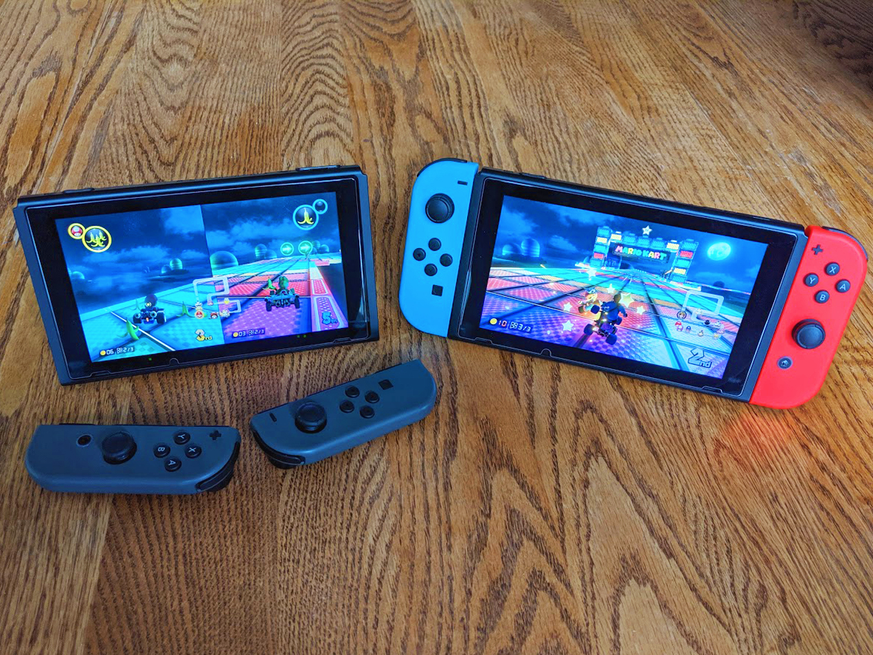 Two Nintendo Switch consoles set up in local wireless play Mario Kart 8 Deluxe