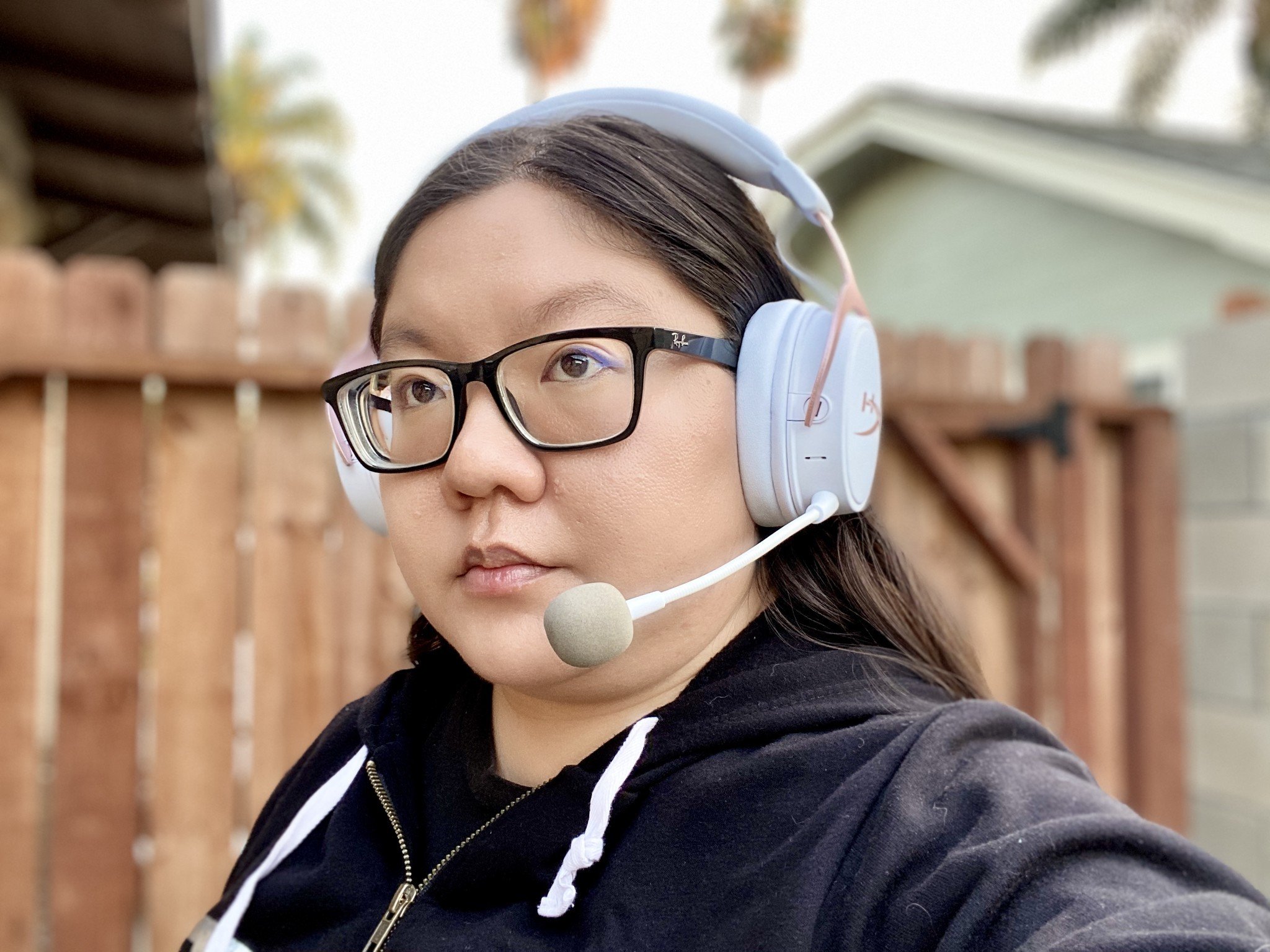 Christine wears HyperX Cloud MIX Rose Gold headphones with mic