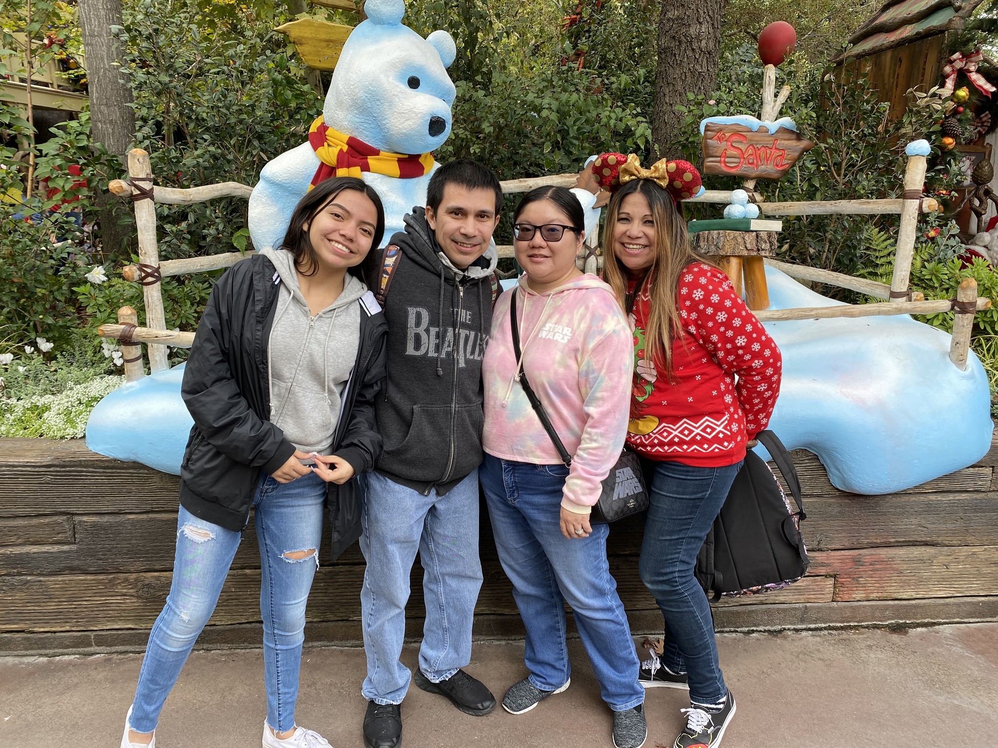 The Romero family at Winnie the Pooh's corner in Disneyland