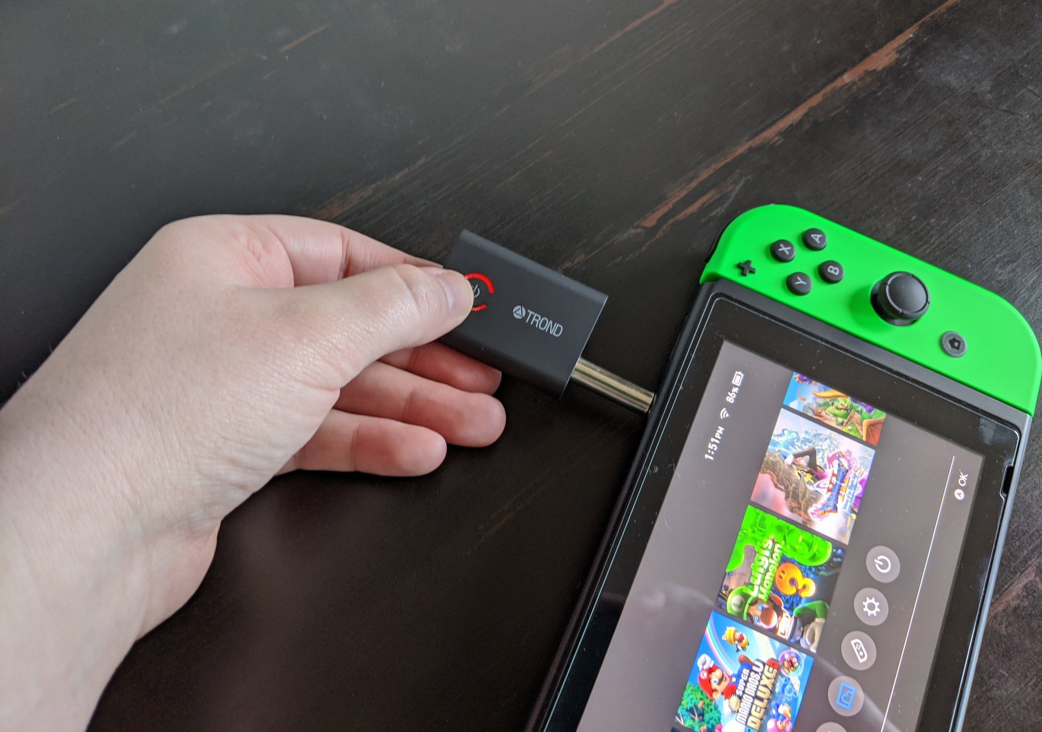 How to use Bluetooth headphones with a Nintendo Switch via the headphone jack: hold down the MFB button for three seconds