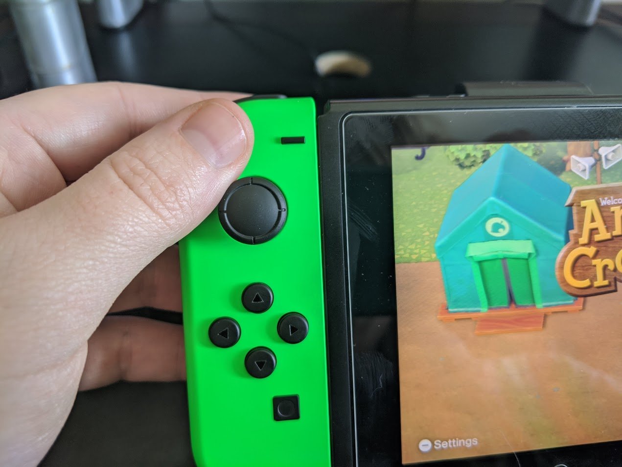 How to scan QR codes in ACNH: Press the - button on the left side of your Joy-Cons or controller