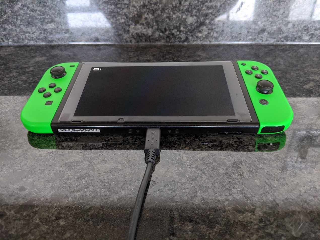 What to do if your Nintendo Switch won't charge step four: unplug the charger from both the outlet and the Switch