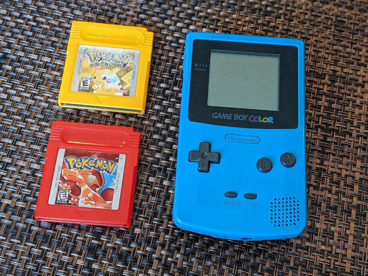 Game Boy Color With Pokemon Red And Yellow