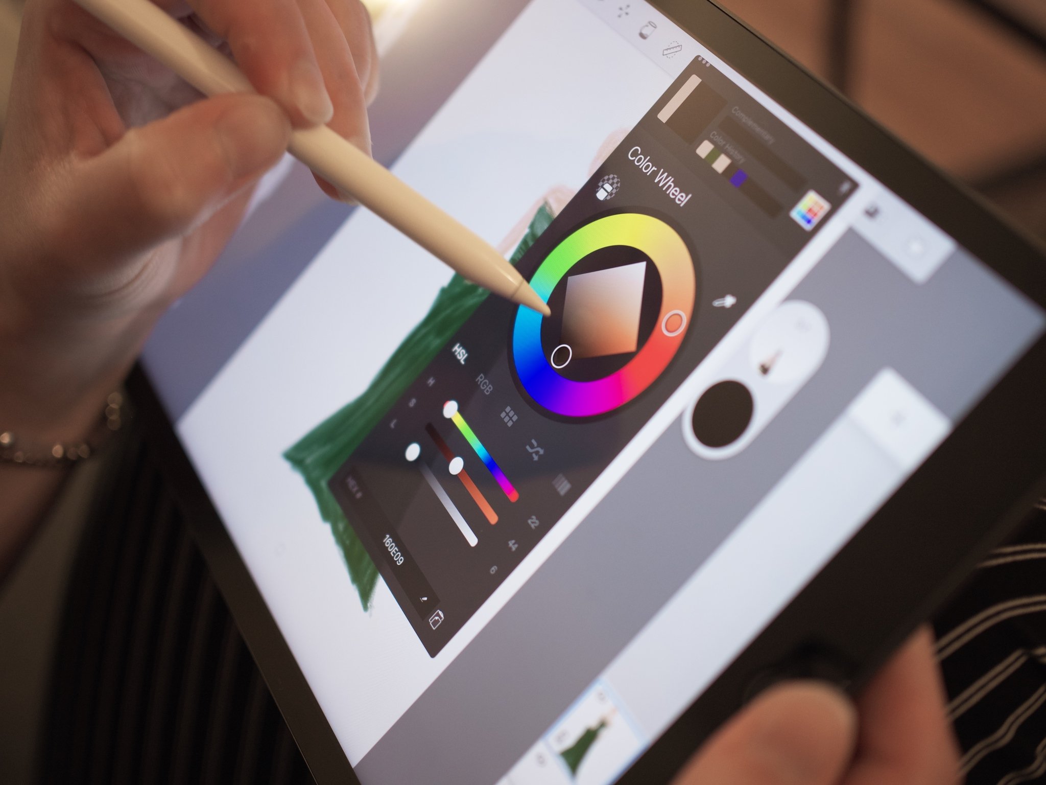 Apple Pencil using color wheel tool in drawing app