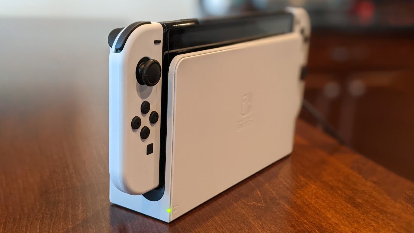 Nintendo Switch Oled Model In Dock Light On