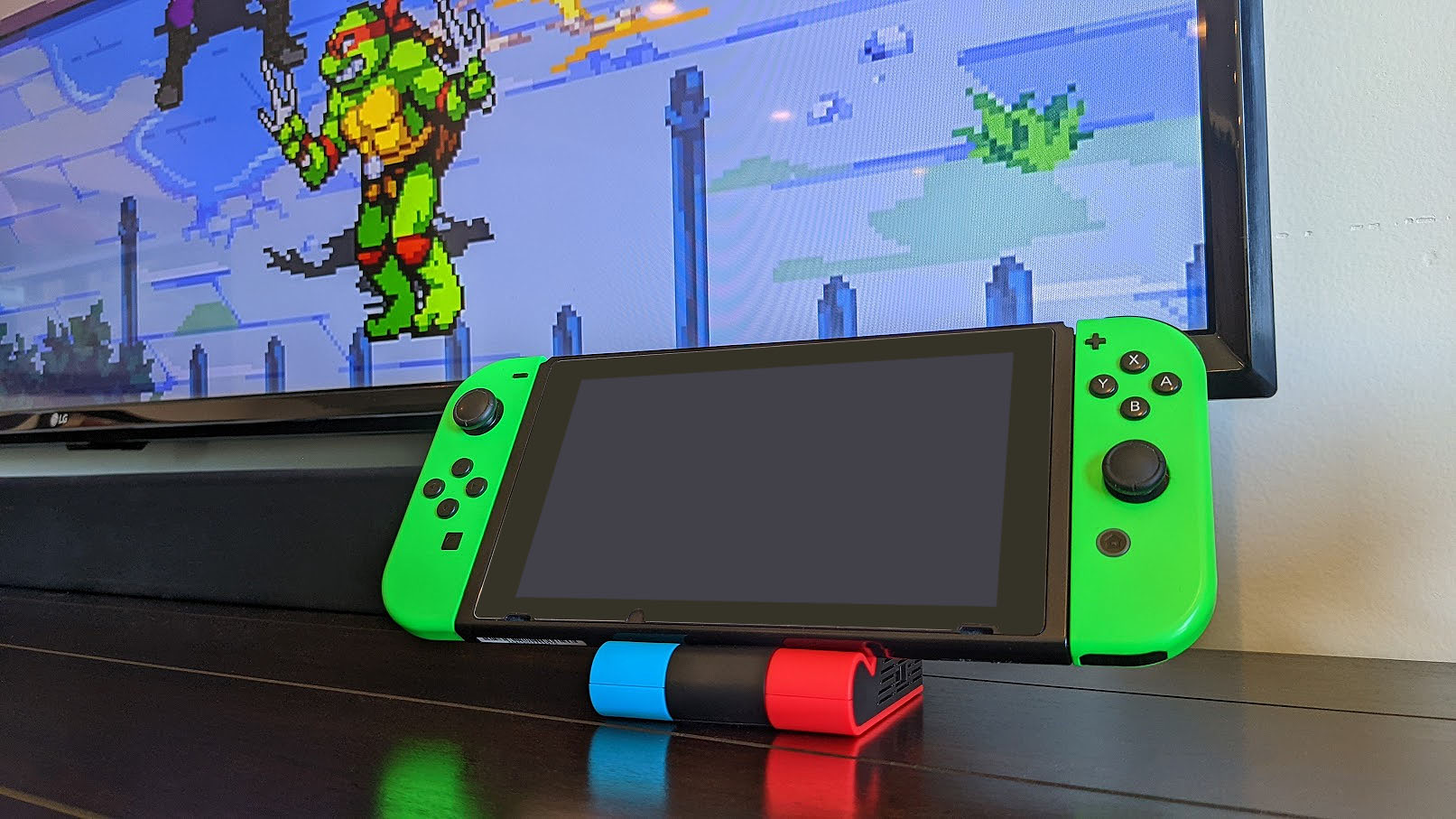 The Unitek Switch docking station connected to turn on the Ninja Turtles TV