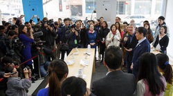 Apple CEO Tim Cook handing out autographed iPhones at China Mobile launch