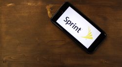 Sprint reports higher post-paid subscriber additions