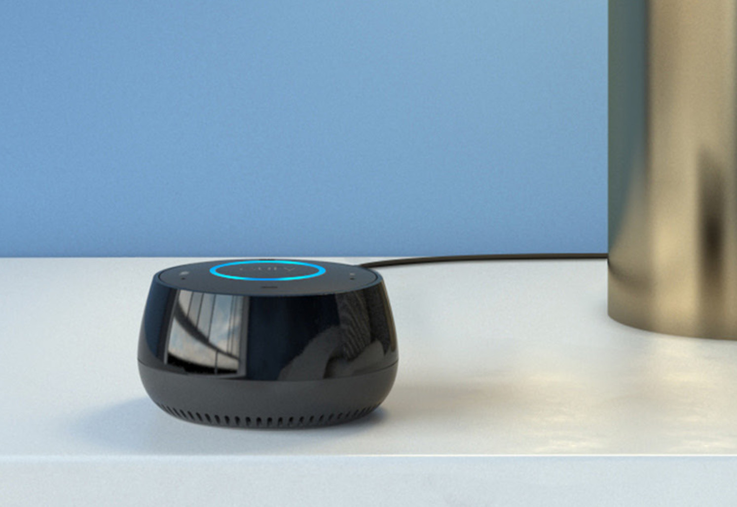 The Anker Eufy Genie is shown sitting atop a desk.