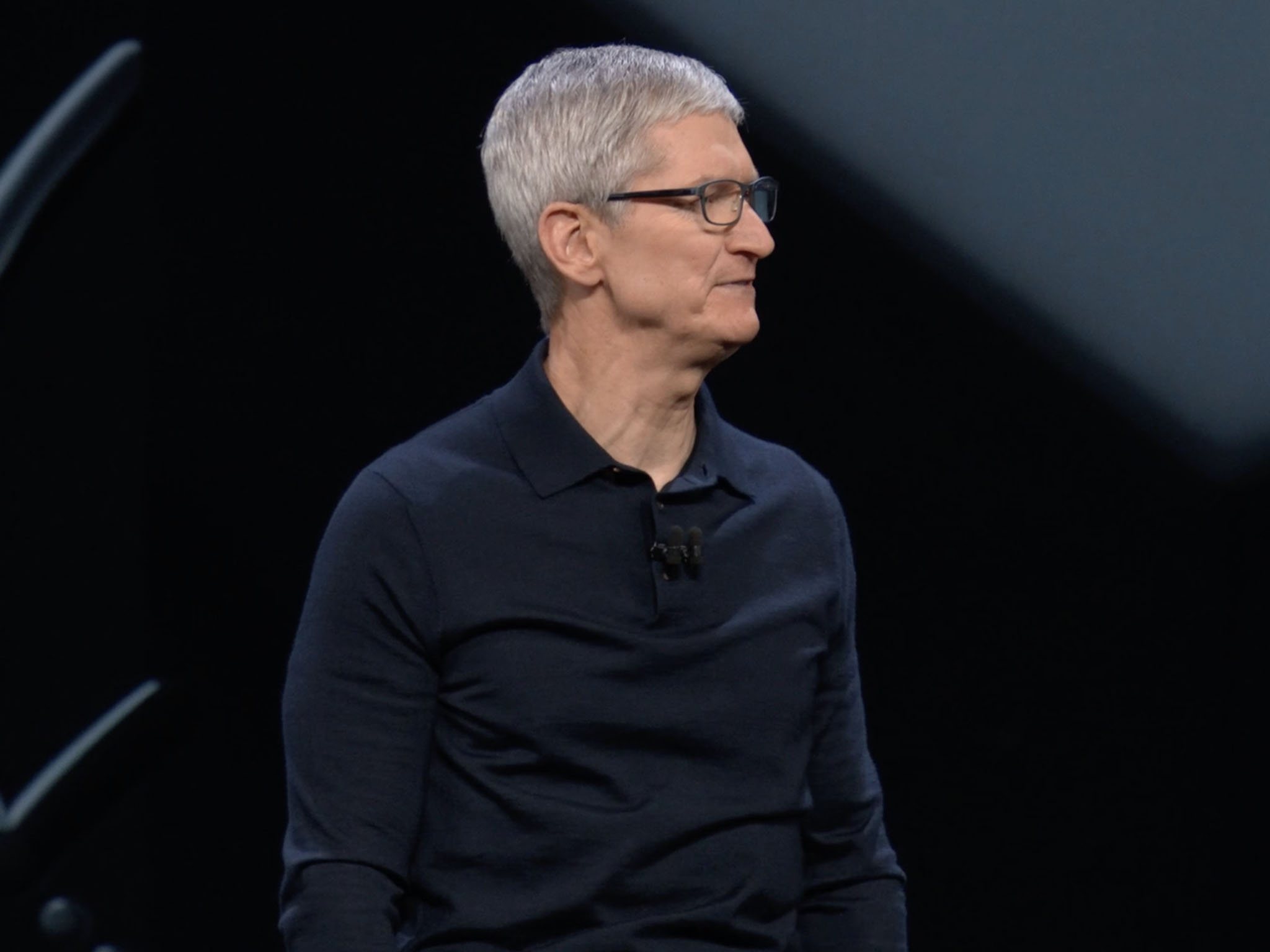 Tim Cook looks across the stage at Apple's WWDC event in 2018