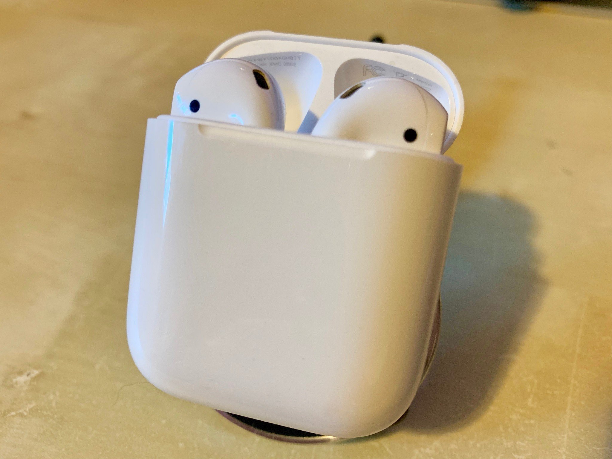 AirPods in their case