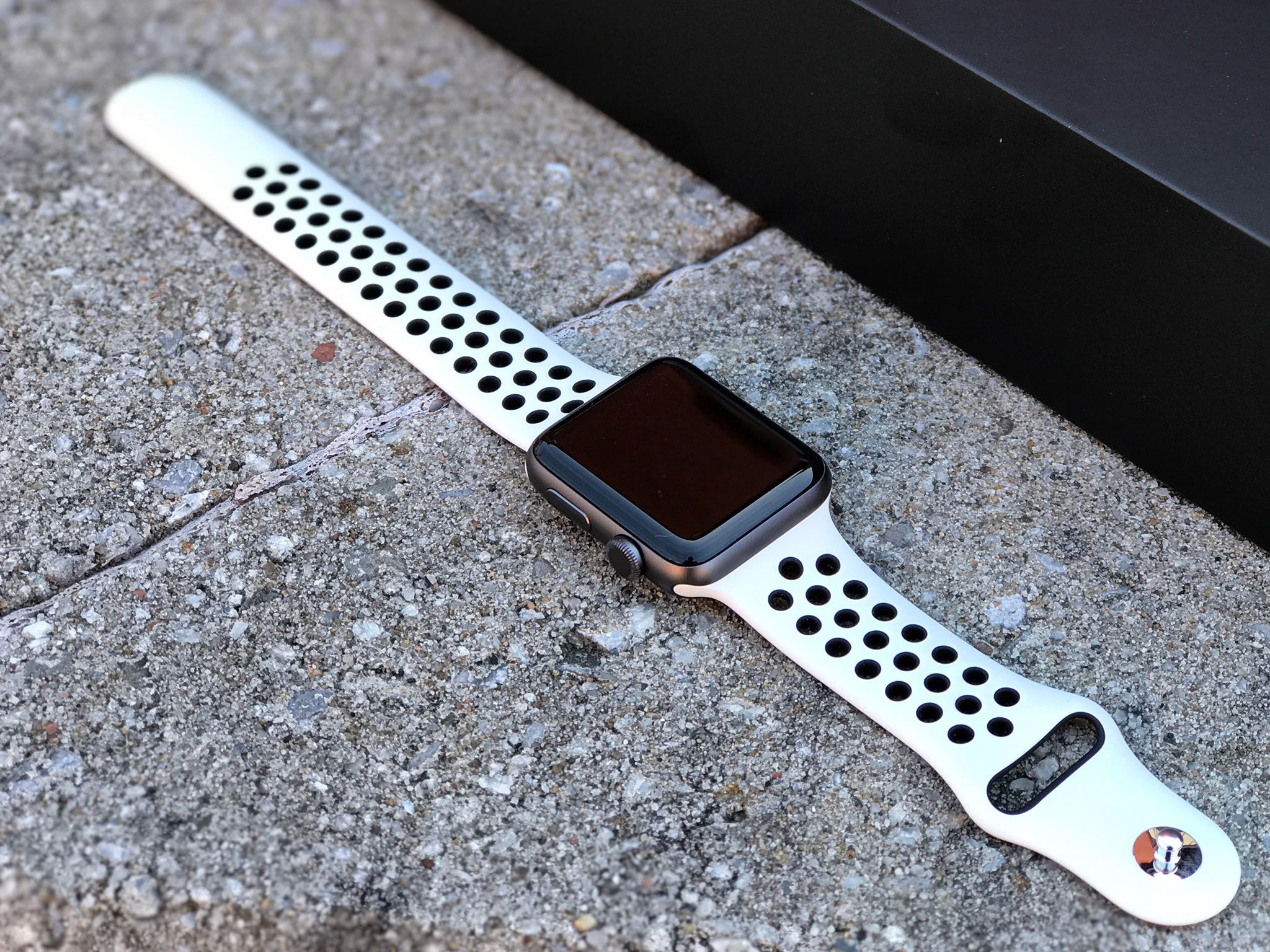 space grey apple watch with white nike band